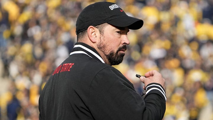 Nov 25, 2023; Ann Arbor, Michigan, USA; Ohio State Buckeyes head coach Ryan Day leads his team in warm-ups prior to the NCAA football game against the Michigan Wolverines at Michigan Stadium.