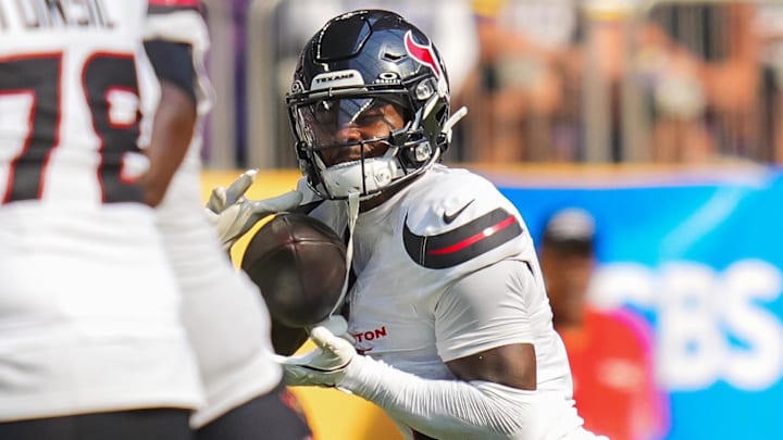 Sep 22, 2024; Minneapolis, Minnesota, USA; Houston Texans wide receiver Stefon Diggs (1) catches a pass against the Minnesota Vikings in the fourth quarter at U.S. Bank Stadium. Mandatory Credit: Brad Rempel-Imagn Images