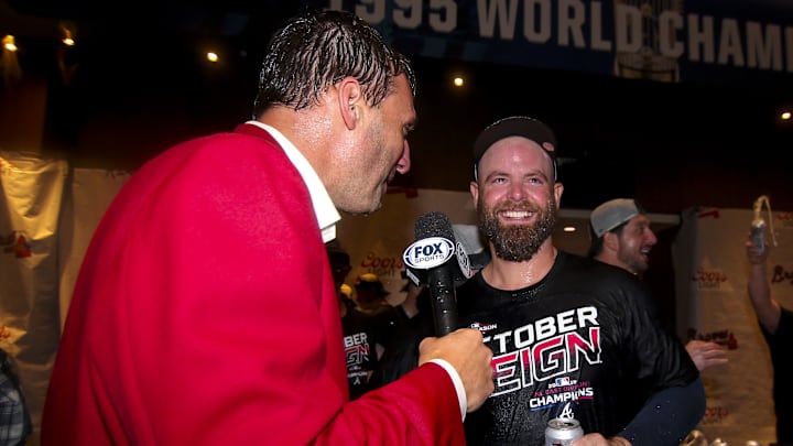Sep 20, 2019; Atlanta, GA, USA; Atlanta Braves broadcaster Jeff Francoeur talks to catcher Brian McCann (16) after clinching the NL East division after defeating the San Francisco Giants at SunTrust Park. Mandatory Credit: Brett Davis-Imagn Images