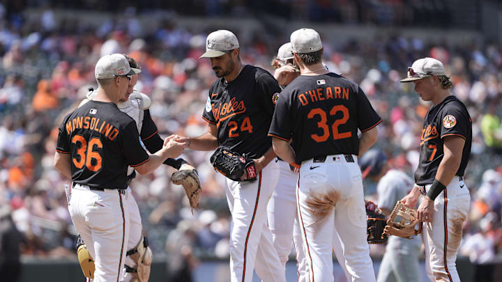 May 18, 2025; Baltimore, Maryland, USA; Baltimore Orioles interim manager Tony Mansolino (36) makes a pitching change taking Baltimore Orioles pitcher Zach Eflin (24) out of the game during the sixth inning against the Washington Nationals at Oriole Park at Camden Yards. 