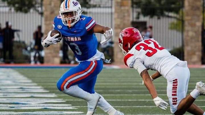 Terrance Grant Jr throwing out a stiff arm. Terrance Grant Jr throwing out a stiff arm.