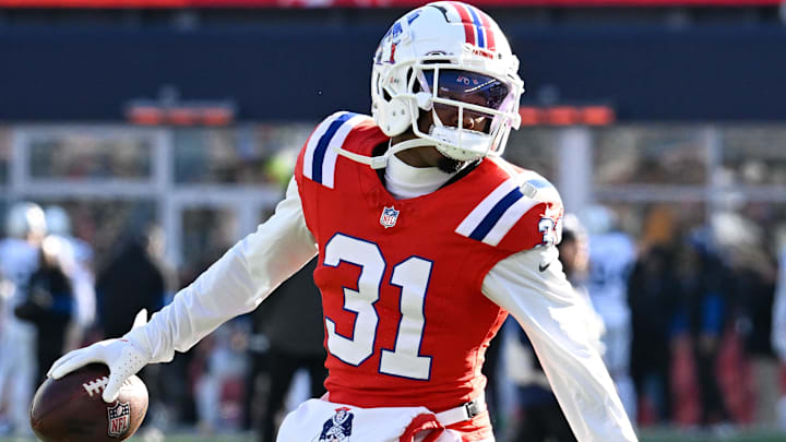 Dec 1, 2024; Foxborough, Massachusetts, USA; New England Patriots cornerback Jonathan Jones (31) warms up before a game against the Indianapolis Colts at Gillette Stadium. Mandatory Credit: Eric Canha-Imagn Images