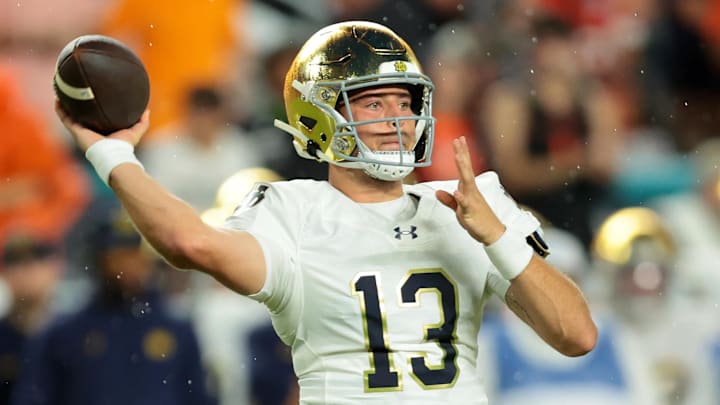 Aug 31, 2025; Miami Gardens, Florida, USA; Notre Dame Fighting Irish quarterback CJ Carr (13) drops back to pass against the Miami Hurricanes during the first quarter at Hard Rock Stadium. Aug 31, 2025; Miami Gardens, Florida, USA; Notre Dame Fighting Irish quarterback CJ Carr (13) drops back to pass against the Miami Hurricanes during the first quarter at Hard Rock Stadium.