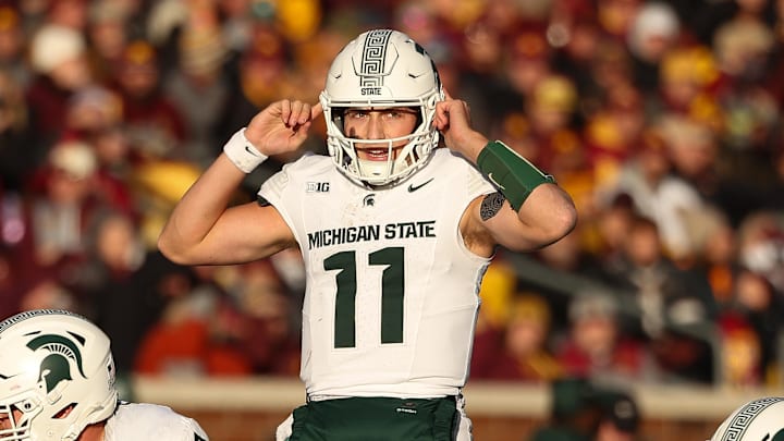 Nov 1, 2025; Minneapolis, Minnesota, USA; Michigan State Spartans quarterback Alessio Milivojevic (11) calls a play against the Minnesota Golden Gophers during the second half at Huntington Bank Stadium.