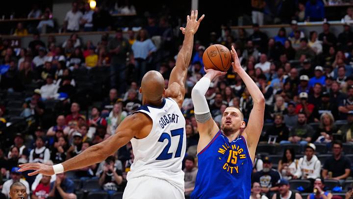 Apr 20, 2026; Denver, Colorado, USA; Minnesota Timberwolves center Rudy Gobert (27) defends on Denver Nuggets center Nikola Jokic (15) in the second half during game two of the first round of the 2026 NBA Playoffs at Ball Arena. Mandatory Credit: Ron Chenoy-Imagn Images Apr 20, 2026; Denver, Colorado, USA; Minnesota Timberwolves center Rudy Gobert (27) defends on Denver Nuggets center Nikola Jokic (15) in the second half during game two of the first round of the 2026 NBA Playoffs at Ball Arena. Mandatory Credit: Ron Chenoy-Imagn Images