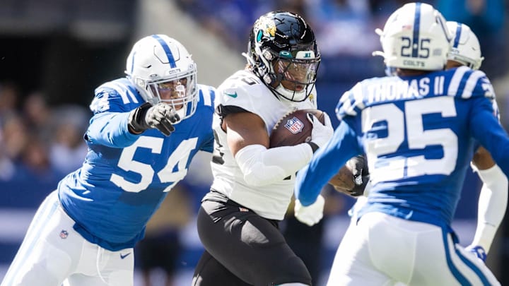 New Bears edge player Dayo Odeyingbo reaches out to try and stop running back James Robinson in a 2022 game with the Jaguars.