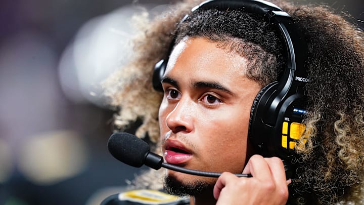 Oct 20, 2023; Carrollton, GA, USA; Carrollton Trojans quarterback Julian Lewis (10) watches on from the sidelines against the Westlake Lions during the first half at Grisham Stadium. The 15-year-old Carrollton High student has already committed to playing for the University of Southern California Trojans and has been considered one of the top high school quarterback prospects. Mandatory Credit: John David Mercer-Imagn Images Oct 20, 2023; Carrollton, GA, USA; Carrollton Trojans quarterback Julian Lewis (10) watches on from the sidelines against the Westlake Lions during the first half at Grisham Stadium. The 15-year-old Carrollton High student has already committed to playing for the University of Southern California Trojans and has been considered one of the top high school quarterback prospects. Mandatory Credit: John David Mercer-Imagn Images