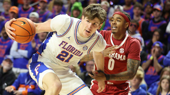 Florida forward Alex Condon (21) steals the ball from Alabama guard Labaron Philon (0) during the first half of an NCAA Mens basketball game at Steven C. O'Connell Center Exactek arena in Gainesville, FL on Sunday, February 1, 2026. [Alan Youngblood/Gainesville Sun]