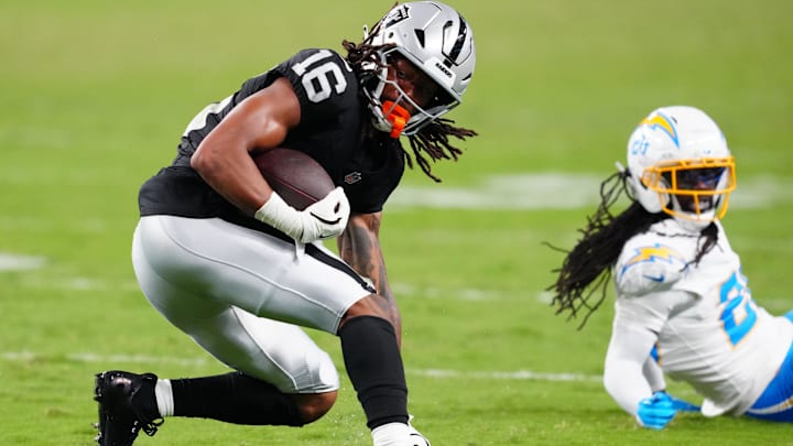 Sep 15, 2025; Paradise, Nevada, USA; Las Vegas Raiders wide receiver Jakobi Meyers (16) breaks a tackle from Los Angeles Chargers cornerback Donte Jackson (26) during the fourth quarter at Allegiant Stadium. Mandatory Credit: Stephen R. Sylvanie-Imagn Images Sep 15, 2025; Paradise, Nevada, USA; Las Vegas Raiders wide receiver Jakobi Meyers (16) breaks a tackle from Los Angeles Chargers cornerback Donte Jackson (26) during the fourth quarter at Allegiant Stadium. Mandatory Credit: Stephen R. Sylvanie-Imagn Images