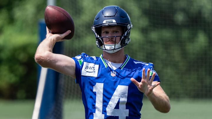 Jun 11, 2025; Renton, WA, USA; Seattle Seahawks quarterback Sam Darnold (14) passes the ball during mini-camp at Virginia Mason Athletic Center. Jun 11, 2025; Renton, WA, USA; Seattle Seahawks quarterback Sam Darnold (14) passes the ball during mini-camp at Virginia Mason Athletic Center.