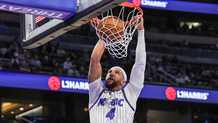 Feb 11, 2026; Orlando, Florida, USA; Orlando Magic guard Jalen Suggs (4) dunks during the second half against the Milwaukee Bucks at Kia Center. Mandatory Credit: Mike Watters-Imagn Images
