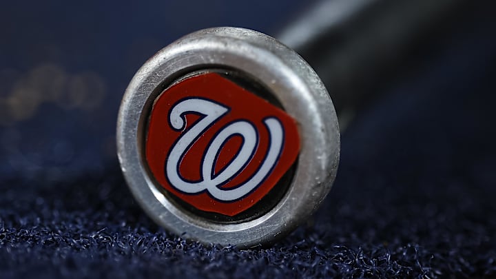 May 12, 2023; Washington, District of Columbia, USA; A detailed view of the Washington Nationals logo on a weighted bat during the seventh inning of the game between the Washington Nationals and the New York Mets at Nationals Park. Mandatory Credit: Scott Taetsch-Imagn Images May 12, 2023; Washington, District of Columbia, USA; A detailed view of the Washington Nationals logo on a weighted bat during the seventh inning of the game between the Washington Nationals and the New York Mets at Nationals Park. Mandatory Credit: Scott Taetsch-Imagn Images