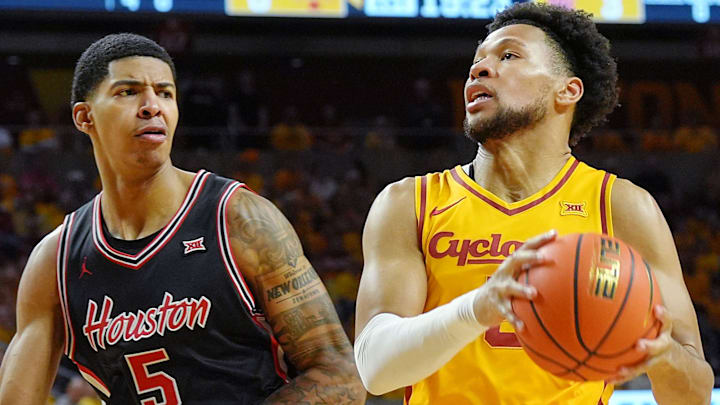 Iowa State Cyclones forward Joshua Jefferson (5) drives with the ball to the basket around Houston Cougars forward/center Chris Cenac Jr.(5) during the first half in the3 Big-12 men’s basketball at Hilton Coliseum on Feb. 16, 2026, in Ames, Iowa