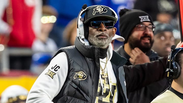 Nov 23, 2024; Kansas City, Missouri, USA;  Colorado head coach Deion Sanders watches the run of play during the 3rd quarter between the Kansas Jayhawks and the Colorado Buffaloes at GEHA Field at Arrowhead Stadium. Mandatory Credit: Nick Tre. Smith-Imagn Images