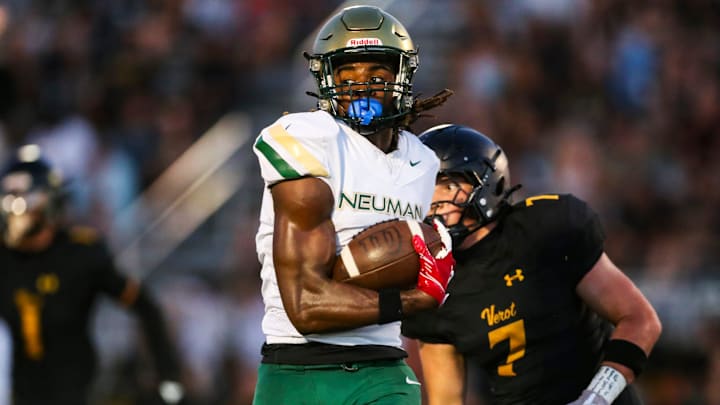 Neumann Celtics receiver Jayden Petit (3) runs after making a catch.