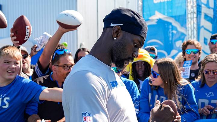 Detroit Lions safety Kerby Joseph signs autographs for fans after practice during training camp at Meijer Performance Center in Allen Park on Monday, August 3, 2026.