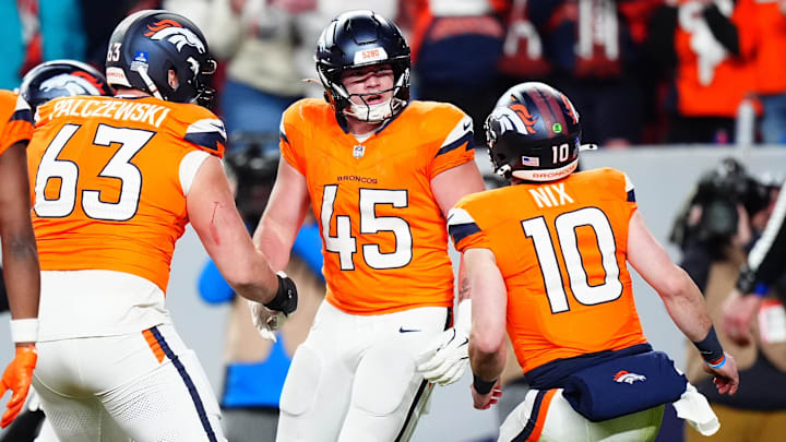 Dec 15, 2024; Denver, Colorado, USA; Denver Broncos tight end Nate Adkins (45) celebrates his touchdown with Denver Broncos quarterback Bo Nix (10) and offensive tackle Alex Palczewski (63) in the fourth quarter against the Indianapolis Colts at Empower Field at Mile High. 