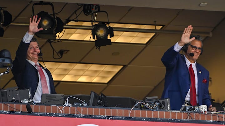 Mar 30, 2023; St. Louis, Missouri, USA;  Bally Sports Midwest announcer Chip Caray and Brad Thompson wave to the fans during the second inning of an opening day game between the St. Louis Cardinals and the Toronto Blue Jays at Busch Stadium. Mandatory Credit: Jeff Curry-Imagn Images