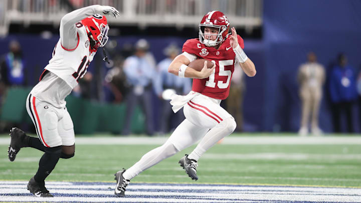Alabama Crimson Tide quarterback Ty Simpson (15) rushes as Georgia Bulldogs linebacker Zayden Walker (10) Alabama Crimson Tide quarterback Ty Simpson (15) rushes as Georgia Bulldogs linebacker Zayden Walker (10)