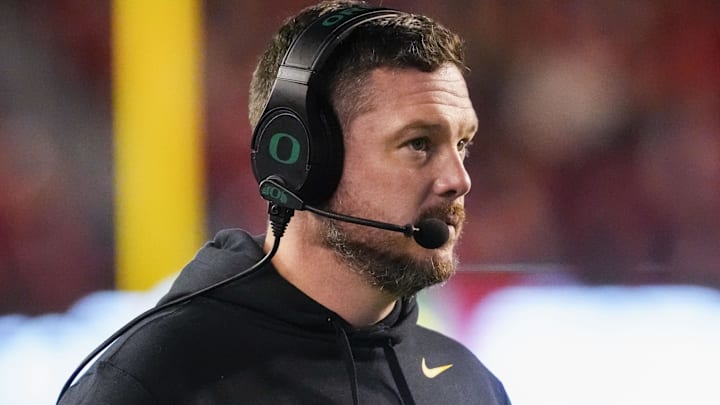 Nov 16, 2024; Madison, Wisconsin, USA; Oregon Ducks head coach Dan Lanning looks on during the first quarter against the Wisconsin Badgers at Camp Randall Stadium. Mandatory Credit: Jeff Hanisch-Imagn Images Nov 16, 2024; Madison, Wisconsin, USA; Oregon Ducks head coach Dan Lanning looks on during the first quarter against the Wisconsin Badgers at Camp Randall Stadium. Mandatory Credit: Jeff Hanisch-Imagn Images