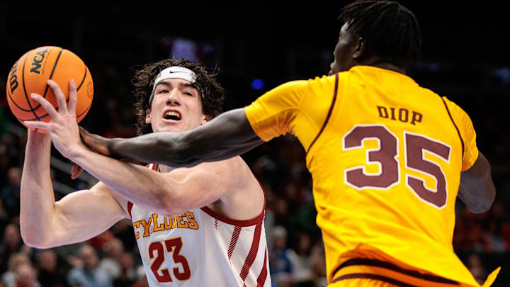 Mar 11, 2026; Kansas City, MO, USA; Iowa State Cyclones forward Blake Buchanan (23) drives to the basket around Arizona State Sun Devils center Massamba Diop (35) during the first half at T-Mobile Center.