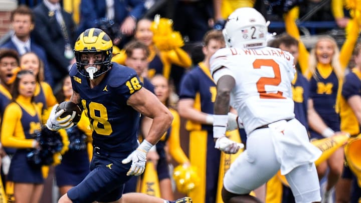 Michigan tight end Colston Loveland (18) makes a catch against Texas defensive back Derek Williams Jr. (2) during the first half at Michigan Stadium in Ann Arbor on Saturday, September 7, 2024.