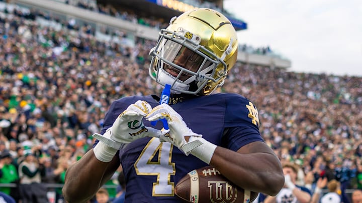 Notre Dame Fighting Irish running back Jeremiyah Love celebrates scoring against the Syracuse Orange 