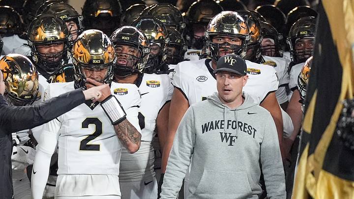 Jan 2, 2026; Charlotte, NC, USA; Wake Forest Demon Deacons head coach Jake Dickert prepares to lead his team onto the field for the Duke’s Mayo Bowl against the Mississippi State Bulldogs at Bank of America Stadium. Photo by Jim Dedmon Jan 2, 2026; Charlotte, NC, USA; Wake Forest Demon Deacons head coach Jake Dickert prepares to lead his team onto the field for the Duke’s Mayo Bowl against the Mississippi State Bulldogs at Bank of America Stadium. Photo by Jim Dedmon
