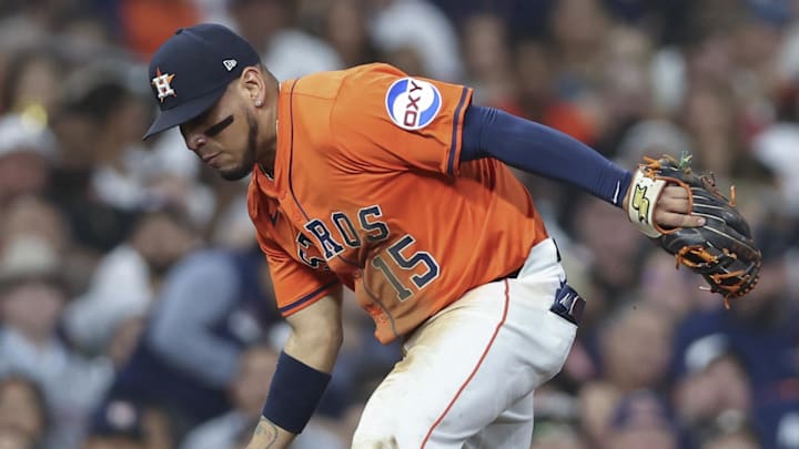 Jul 11, 2025; Houston, Texas, USA; Houston Astros third baseman Isaac Paredes (15) is unable to make a play on a ground ball during the fifth inning against the Texas Rangers at Daikin Park. 