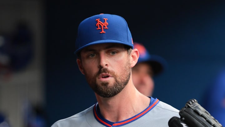 Apr 2, 2025; Miami, Florida, USA; New York Mets starting pitcher Clay Holmes (35) celebrates with teammates after leaving the game against the Miami Marlins during the fifth inning at loanDepot Park. Mandatory Credit: Sam Navarro-Imagn Images