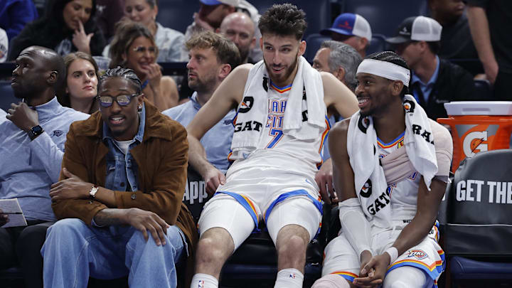 Nov 12, 2025; Oklahoma City, Oklahoma, USA; Oklahoma City Thunder guard Jalen Williams (8), center Chet Holmgren (7), and guard Shai Gilgeous-Alexander (2) talk while sitting on the bench during the fourth quarter against the Los Angeles Lakers at Paycom Center. Mandatory Credit: Alonzo Adams-Imagn Images Nov 12, 2025; Oklahoma City, Oklahoma, USA; Oklahoma City Thunder guard Jalen Williams (8), center Chet Holmgren (7), and guard Shai Gilgeous-Alexander (2) talk while sitting on the bench during the fourth quarter against the Los Angeles Lakers at Paycom Center. Mandatory Credit: Alonzo Adams-Imagn Images
