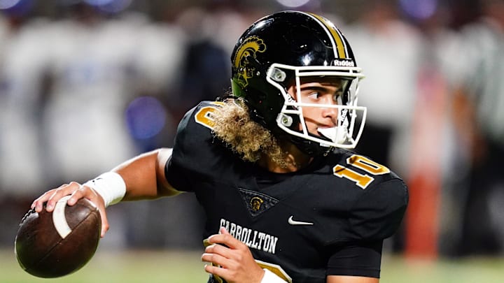 Oct 20, 2023; Carrollton, GA, USA; Carrollton Trojans quarterback Julian Lewis (10) scrambles out of the pocket against the Westlake Lions during the first half at Grisham Stadium. The 15-year-old Carrollton High student has already committed to playing for the University of Southern California Trojans and has been considered one of the top high school quarterback prospects. Mandatory Credit: John David Mercer-Imagn Images Oct 20, 2023; Carrollton, GA, USA; Carrollton Trojans quarterback Julian Lewis (10) scrambles out of the pocket against the Westlake Lions during the first half at Grisham Stadium. The 15-year-old Carrollton High student has already committed to playing for the University of Southern California Trojans and has been considered one of the top high school quarterback prospects. Mandatory Credit: John David Mercer-Imagn Images