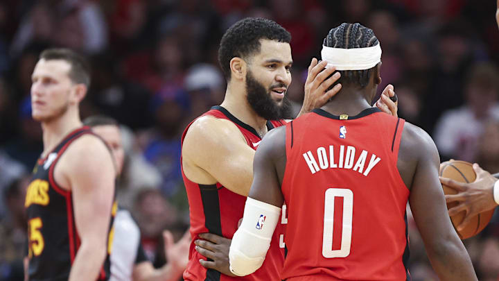 Dec 20, 2023; Houston, Texas, USA; Houston Rockets guard Fred VanVleet (5) and guard Aaron Holiday (0) react during the third quarter against the Atlanta Hawks at Toyota Center. Mandatory Credit: Troy Taormina-Imagn Images