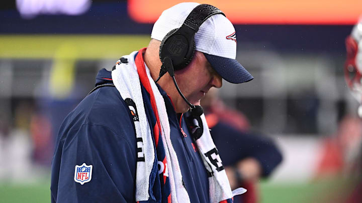 August 8, 2024; Foxborough, MA, USA;  New England Patriots offensive coordinator Alex Van Pelt  checks his play card during the first half against the Carolina Panthers at Gillette Stadium. Mandatory Credit: Eric Canha-Imagn Images