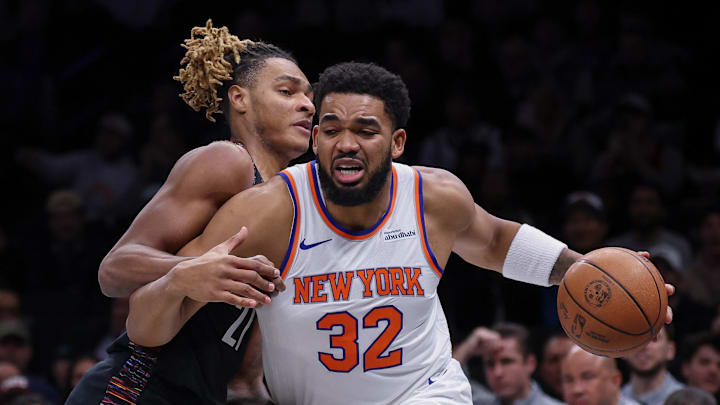 Nov 24, 2025; Brooklyn, New York, USA; New York Knicks center Karl-Anthony Towns (32) drives to the basket against Brooklyn Nets forward Noah Clowney (21) during the first quarter at Barclays Center. Mandatory Credit: Vincent Carchietta-Imagn Images Nov 24, 2025; Brooklyn, New York, USA; New York Knicks center Karl-Anthony Towns (32) drives to the basket against Brooklyn Nets forward Noah Clowney (21) during the first quarter at Barclays Center. Mandatory Credit: Vincent Carchietta-Imagn Images