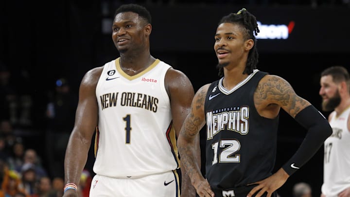 Nov 25, 2022; Memphis, Tennessee, USA; New Orleans Pelicans forward Zion Williamson (1) and Memphis Grizzlies guard Ja Morant (12) talk during free throws during the second half at FedExForum. Mandatory Credit: Petre Thomas-Imagn Images