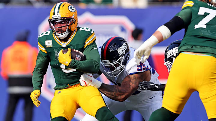 Nov 16, 2025; East Rutherford, New Jersey, USA; Green Bay Packers running back Josh Jacobs (8) runs the ball against New York Giants defensive tackle Roy Robertson-Harris (95) during the first quarter at MetLife Stadium. Nov 16, 2025; East Rutherford, New Jersey, USA; Green Bay Packers running back Josh Jacobs (8) runs the ball against New York Giants defensive tackle Roy Robertson-Harris (95) during the first quarter at MetLife Stadium.