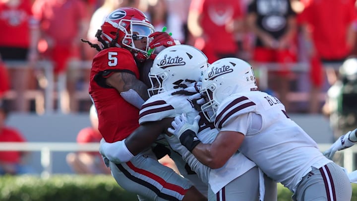 Georgia Bulldogs wide receiver Anthony Evans III (5) is tackled by Mississippi State Bulldogs linebacker Nic Mitchell (40) in the first quarter at Sanford Stadium. Georgia Bulldogs wide receiver Anthony Evans III (5) is tackled by Mississippi State Bulldogs linebacker Nic Mitchell (40) in the first quarter at Sanford Stadium.