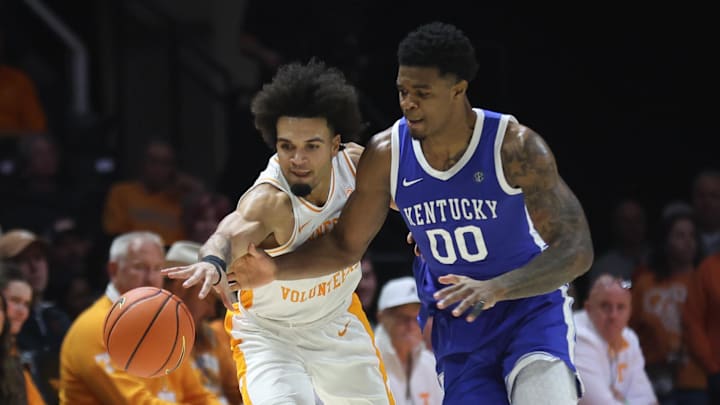Jan 17, 2026; Knoxville, Tennessee, USA; Tennessee Volunteers guard Ja'kobi Gillespie (0) and Kentucky Wildcats guard Otega Oweh (00) go for a loose ball during the second half at Thompson-Boling Arena at Food City Center. Mandatory Credit: Randy Sartin-Imagn Images