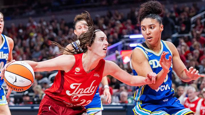 Indiana Fever guard Caitlin Clark (22) dribbles the ball while Dallas Wings guard Azzi Fudd (35) defends Indiana Fever guard Caitlin Clark (22) dribbles the ball while Dallas Wings guard Azzi Fudd (35) defends