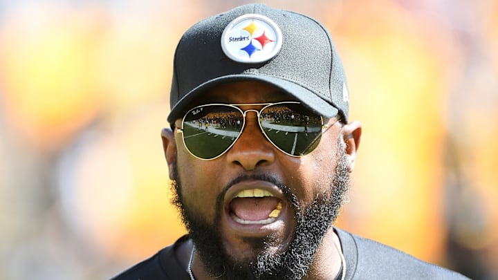 Sep 19, 2021; Pittsburgh, Pennsylvania, USA;  Pittsburgh Steelers head coach Mike Tomlin communicates with his team before playing the Las Vegas Raiders at Heinz Field. The Raiders won the game 26-17. Mandatory Credit: Philip G. Pavely-Imagn Images