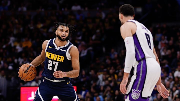 Nov 3, 2025; Denver, Colorado, USA; Denver Nuggets guard Jamal Murray (27) controls the ball as Sacramento Kings guard Zach LaVine (8) guards in the second quarter at Ball Arena. Mandatory Credit: Isaiah J. Downing-Imagn Images