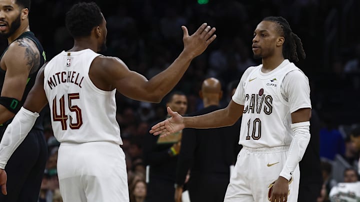 Feb 28, 2025; Boston, Massachusetts, USA; Cleveland Cavaliers guard Donovan Mitchell (45) and guard Darius Garland (10) congratulate each other as Boston Celtics forward Jayson Tatum (0) looks back during the second half at TD Garden. Mandatory Credit: Winslow Townson-Imagn Images