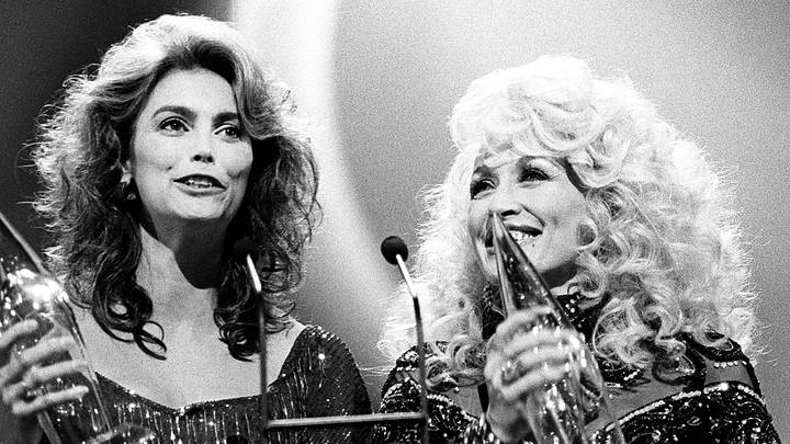 Dolly Parton and Emmylou Harris after winning the award for the Vocal Event of the Year 