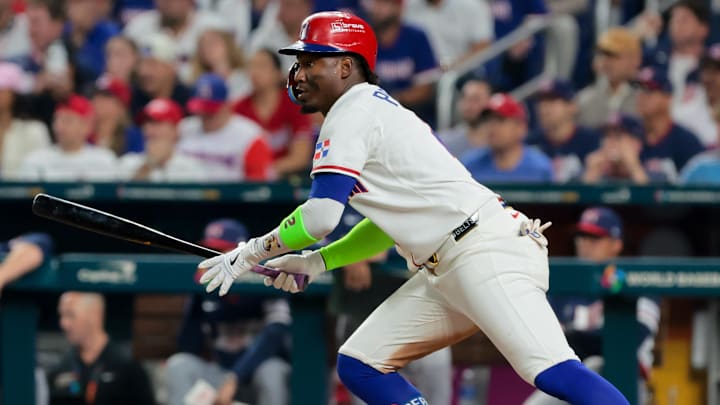 Mar 15, 2026; Miami, FL, United States; Dominican Republic shortstop Geraldo Perdomo (2) singles in the seventh inning against the United States during a semifinal game of the 2026 World Baseball Classic at loanDepot Park. Mandatory Credit: Sam Navarro-Imagn Images