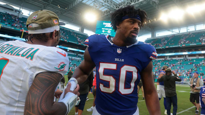 Nov 9, 2025; Miami Gardens, Florida, USA; Miami Dolphins quarterback Tua Tagovailoa (1) greets Buffalo Bills defensive end Greg Rousseau (50) after defeating the Bills at Hard Rock Stadium. Nov 9, 2025; Miami Gardens, Florida, USA; Miami Dolphins quarterback Tua Tagovailoa (1) greets Buffalo Bills defensive end Greg Rousseau (50) after defeating the Bills at Hard Rock Stadium.