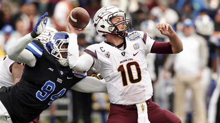 Dec 27, 2014; El Paso, TX, USA; Arizona State Sun Devils quarterback Taylor Kelly (10) gets the ball knocked down by Duke Blue Devils defensive end Jordan DeWalt-Ondijo (94) in the 2014 Sun Bowl at Sun Bowl Stadium. Mandatory Credit: Ivan Pierre Aguirre-Imagn Images