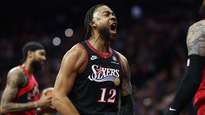 Nov 8, 2025; Philadelphia, Pennsylvania, USA; Philadelphia 76ers forward Trendon Watford (12) reacts after a score and foul against the Toronto Raptors during the first quarter at Xfinity Mobile Arena. Mandatory Credit: Bill Streicher-Imagn Images