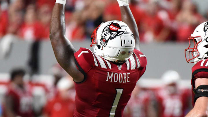 Nov 5, 2022; Raleigh, North Carolina, USA; North Carolina State Wolfpack linebacker Isaiah Moore (1) celebrates a sack during the first half against the Wake Forest Demon Deacons at Carter-Finley Stadium. Mandatory Credit: Rob Kinnan-Imagn Images Nov 5, 2022; Raleigh, North Carolina, USA; North Carolina State Wolfpack linebacker Isaiah Moore (1) celebrates a sack during the first half against the Wake Forest Demon Deacons at Carter-Finley Stadium. Mandatory Credit: Rob Kinnan-Imagn Images