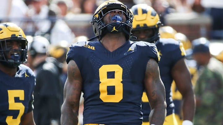 Michigan defensive end Derrick Moore celebrates a tackle against UNLV.